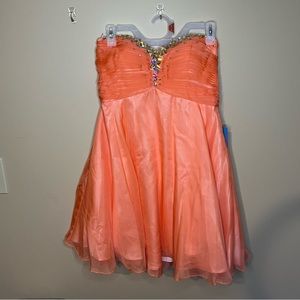 NWT Short Strapless Lace Up
Homecoming Dress by Alyce
Paris Pink/Coral